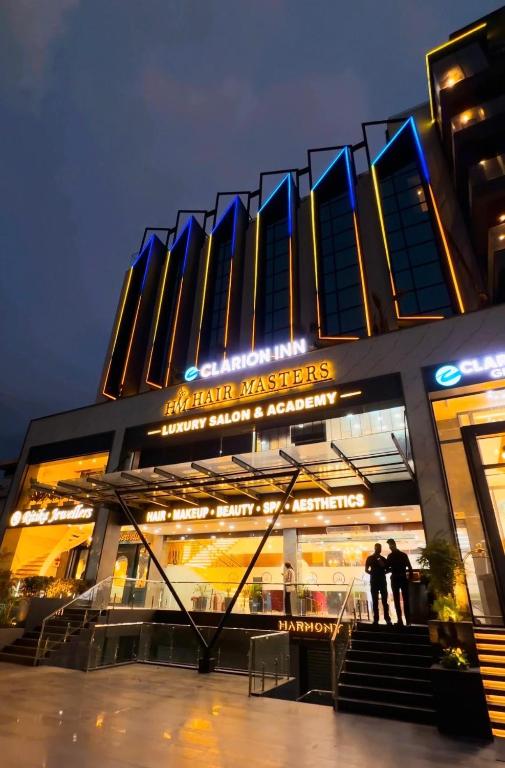 a building with people standing in front of it at Clarion Inn Greywall By Choice Hotels in Amritsar
