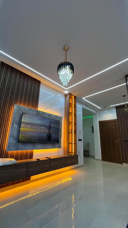 a lobby with a large painting on the wall at Exclusive Modern Garden Flat ,Marrakech in Marrakesh