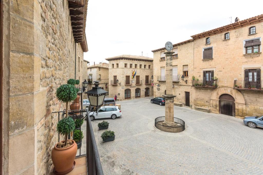 a view from a balcony of a street with cars at Hotel Villa de Cretas in Cretas