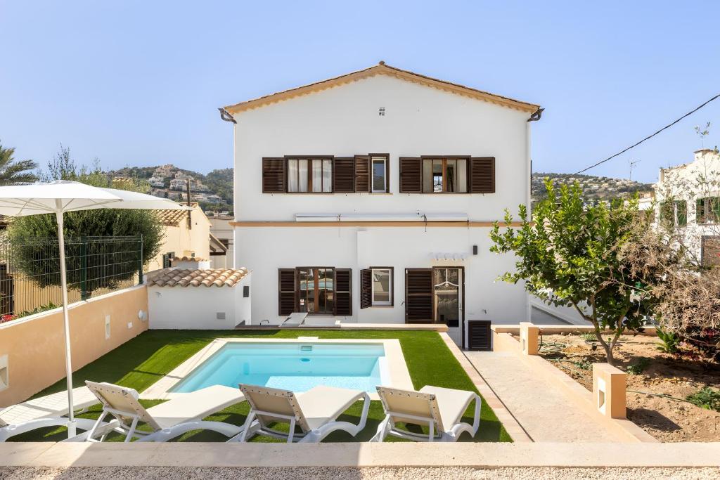 a villa with a swimming pool and a house at Ca Ne Margalide - Andratx in Port d'Andratx