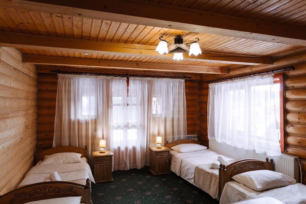 Postel nebo postele na pokoji v ubytování Hotel Marilen