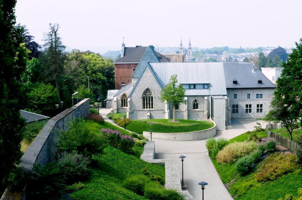 an aerial view of a church and a building at Kloster Heidberg in Eupen