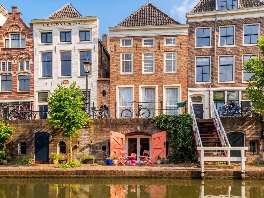 a row of buildings next to a river at Wilsons in Utrecht