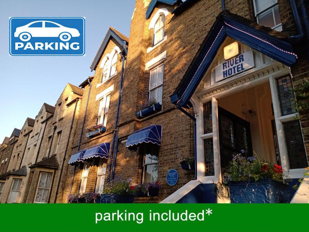a building with a car parked in front of it at River Hotel in Oxford