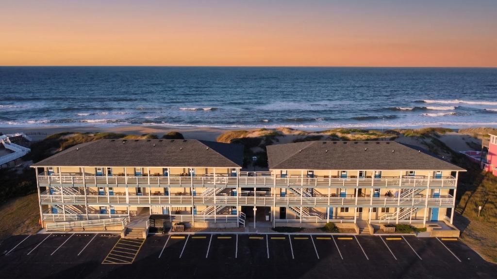 an aerial view of a building next to the ocean at Blue Heron Motel in Nags Head