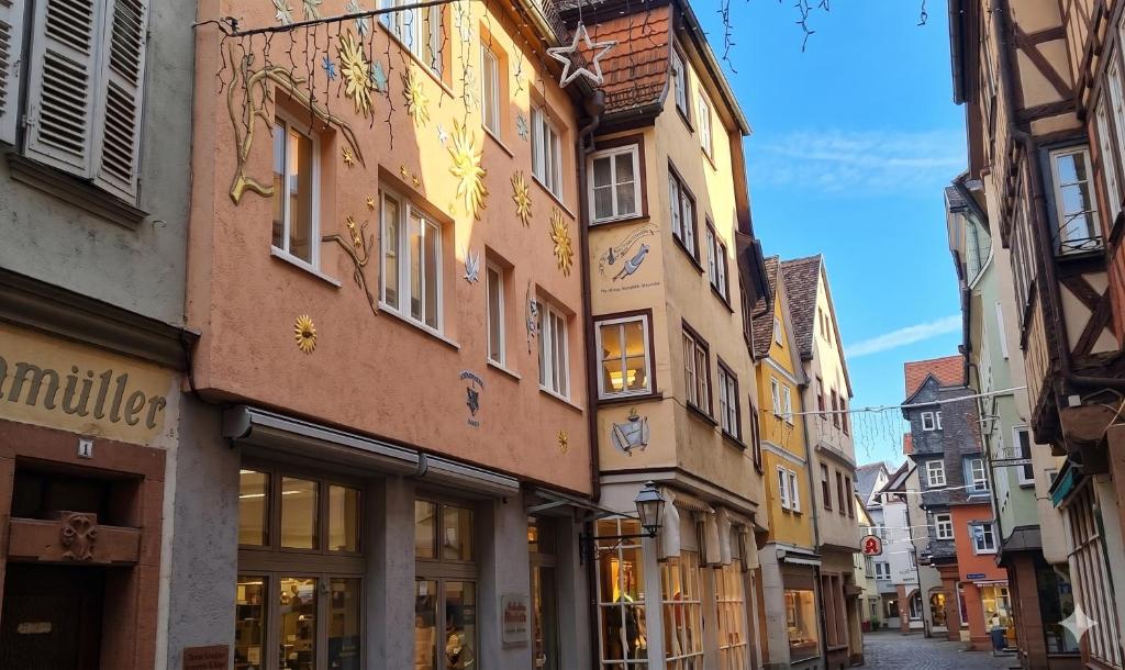 an alley in a city with buildings at Malerwinkel Hotel in Wertheim
