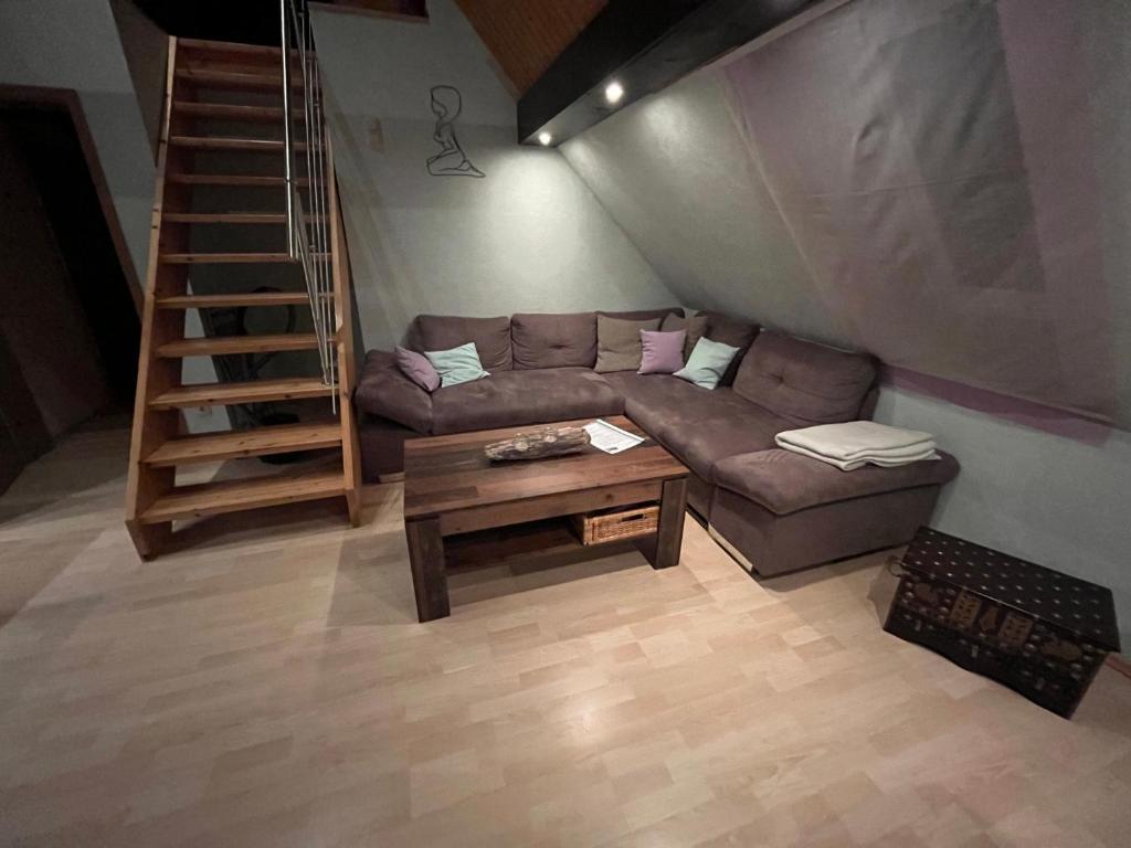 a living room with a couch and a table at Ferienwohnung in Ivenack, DG in Ivenack