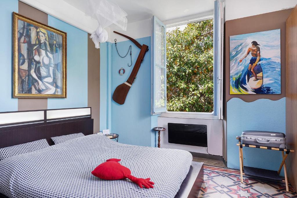 a bedroom with a bed with a red stuffed animal on it at Sentieri in Levanto