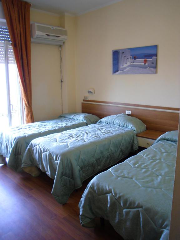 Postel nebo postele na pokoji v ubytování Hotel Mirage