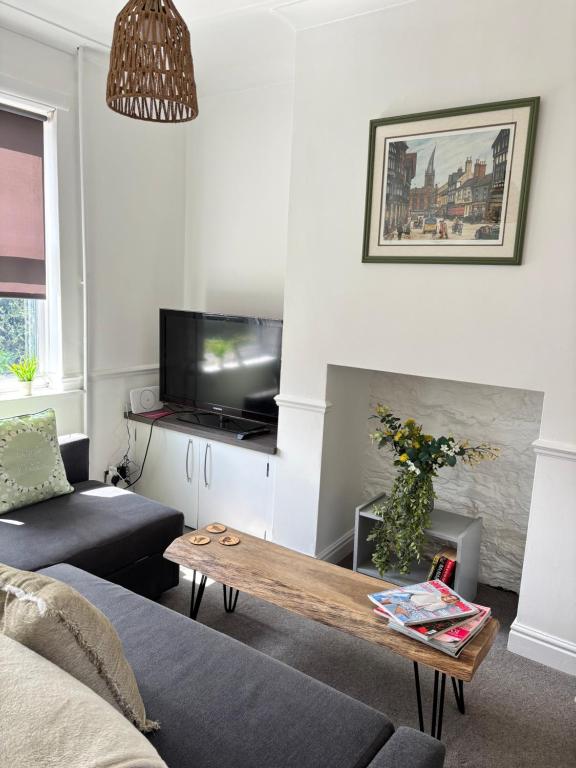 a living room with a couch and a coffee table at Peak Retreat in Chesterfield