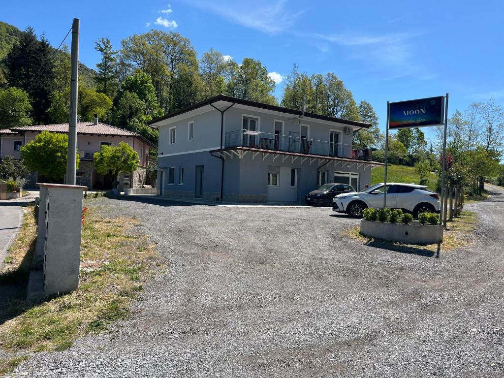 a building with a car parked in front of it at Moon Valley Holiday Home in Lauria Inferiore