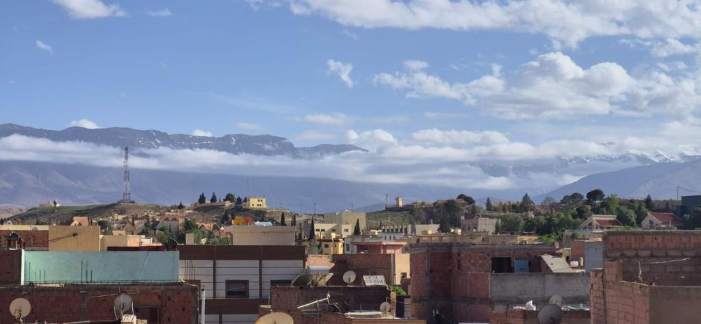 a view of a city with mountains in the background at DowntownHouse in Midelt in Midelt