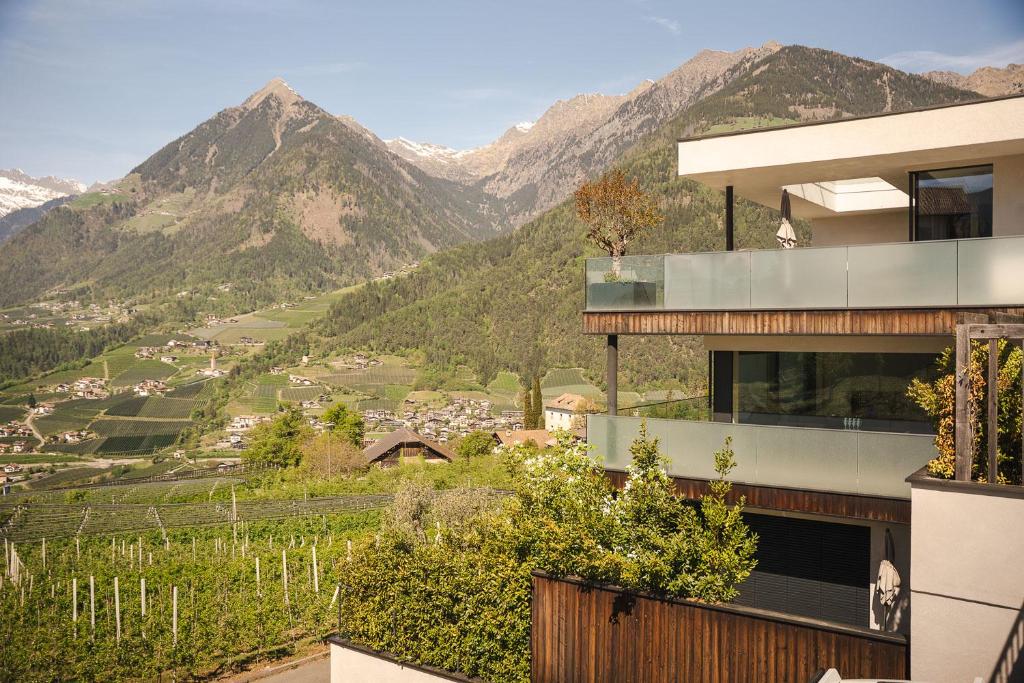 a house with a view of a valley and mountains at View House - Chalet Goyen in Schenna