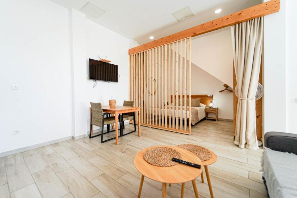 a living room with a couch and a table at Sunny Day Deluxe 10 in Arguineguín