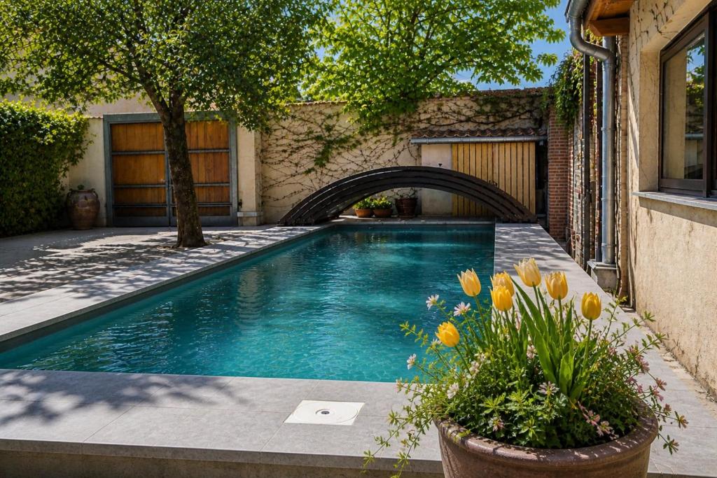 a swimming pool in front of a house at Casa rural con piscina cubierta en Segovia - Viento de Ladera in Segovia