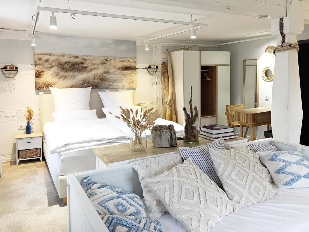 a bedroom with two white beds and a table at NOX HOTEL - Digital-Check-In - No Reception - nahe Bretten & Karlsruhe - 6 Beach in Wössingen
