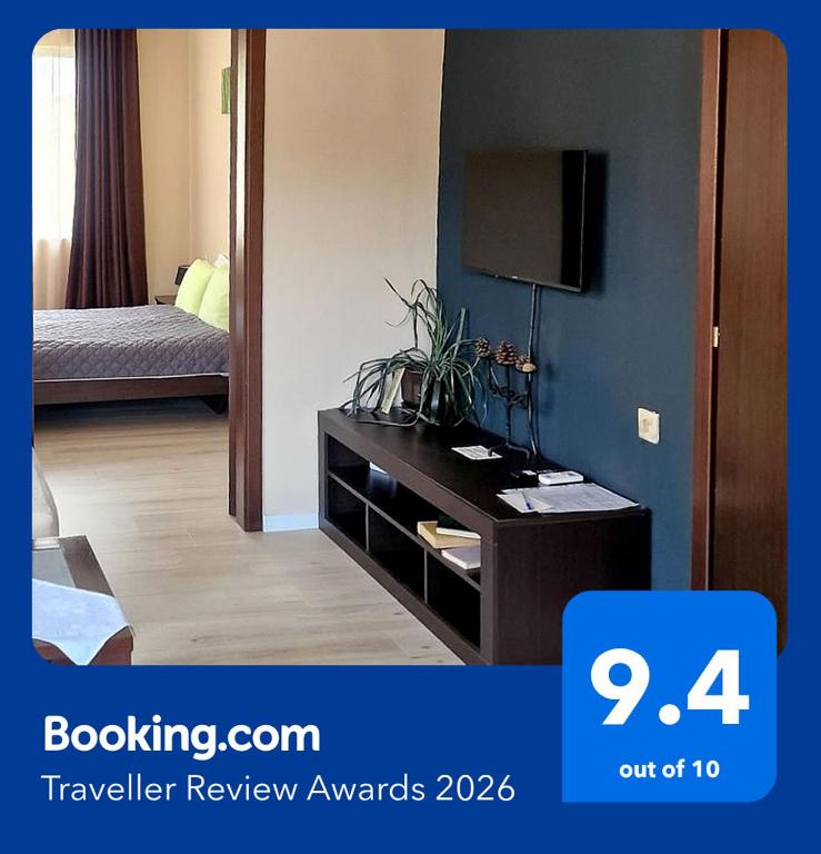 a room with a dresser with a television in it at Belogradchik View Apartment in Belogradchik
