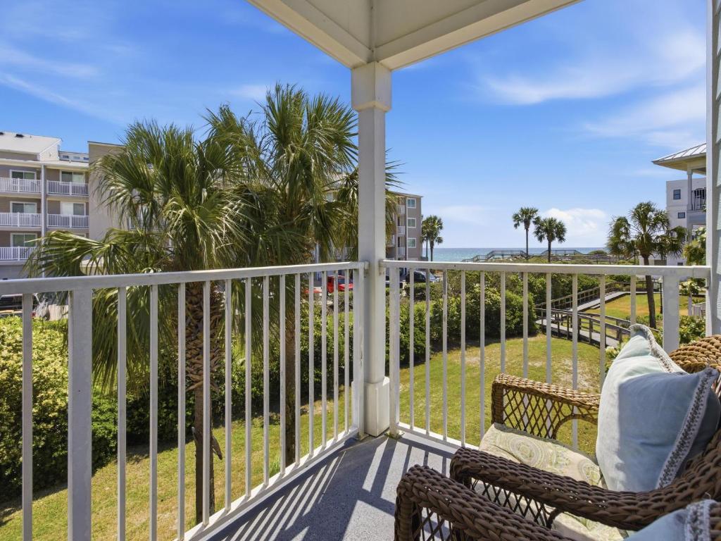 a porch with chairs and a view of the ocean at Beachside Villas #821 - Dreamweaver in Seagrove Beach