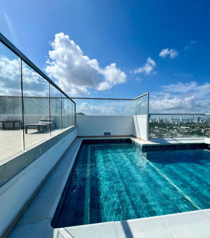 a swimming pool on the roof of a building at Cartagena Flat Resort in Cartagena de Indias