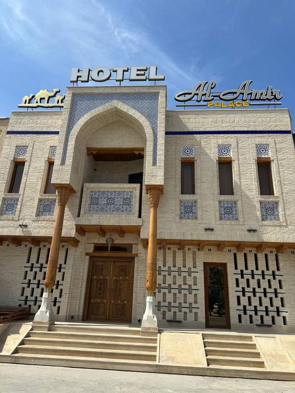 a hotel building with a sign on top of it at Hotel Al Amir palace boutique in Bukhara