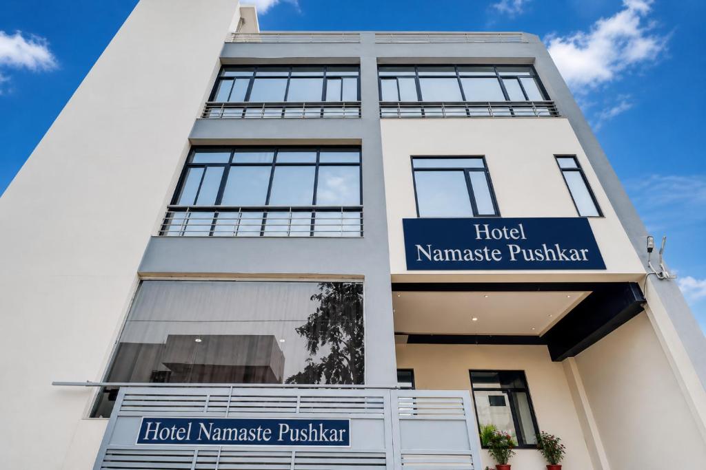 a building with a sign that reads hotel namaste practitioner at Hotel Namaste Pushkar in Pushkar