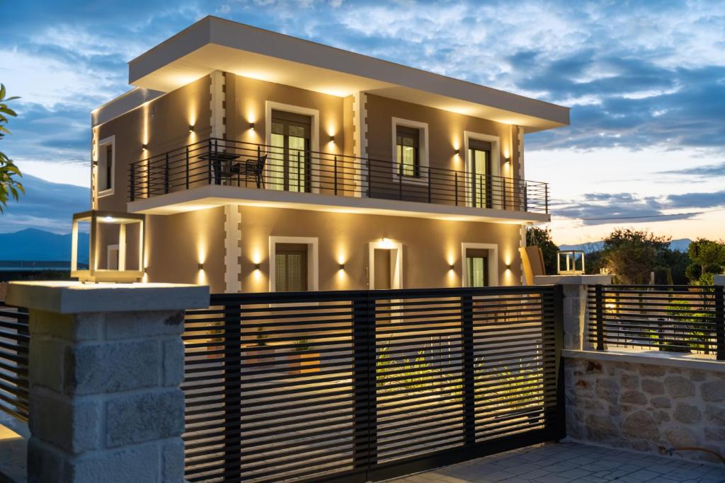 a house with a fence in front of it at Antaia 2 in Nafplio