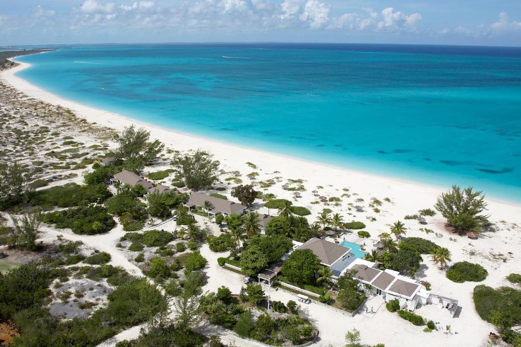 an aerial view of a resort on a beach at The Meridian Club, Turks and Caicos in Providenciales