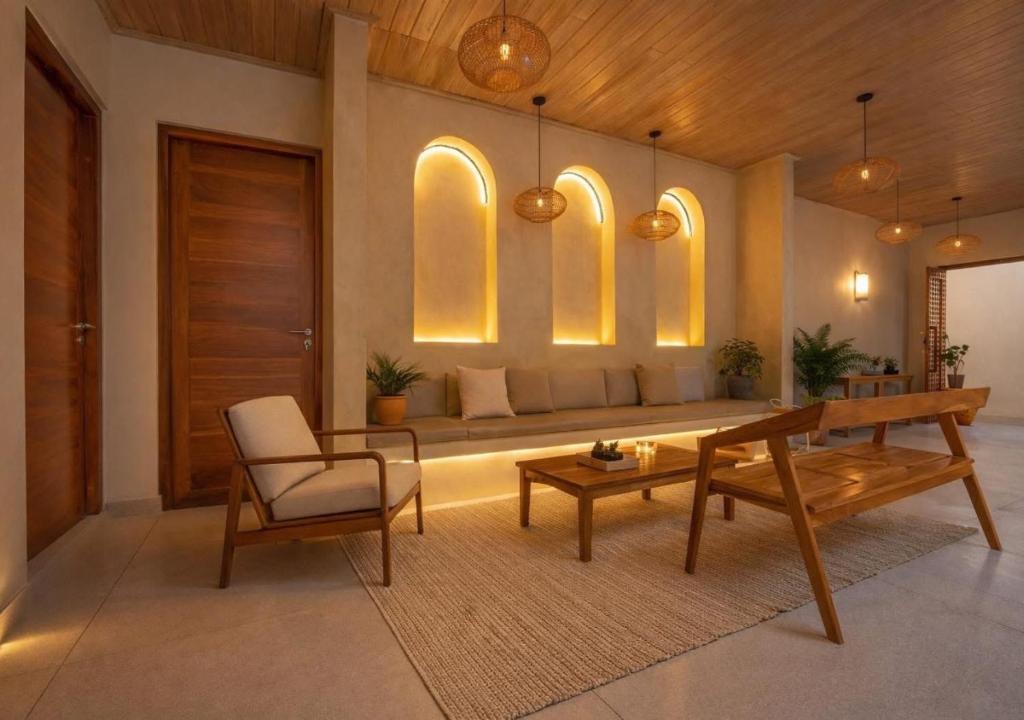 a living room with a couch and a table and a chair at Cavendish Polhena in Matara
