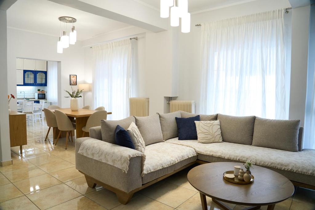 a living room with a couch and a dining room at Lagoon Dream in Fanari
