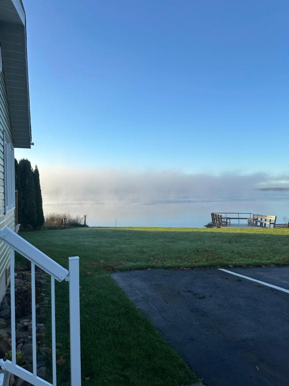 a porch of a house with a view of the ocean at Riverfront Studios Inn in Sault Ste. Marie