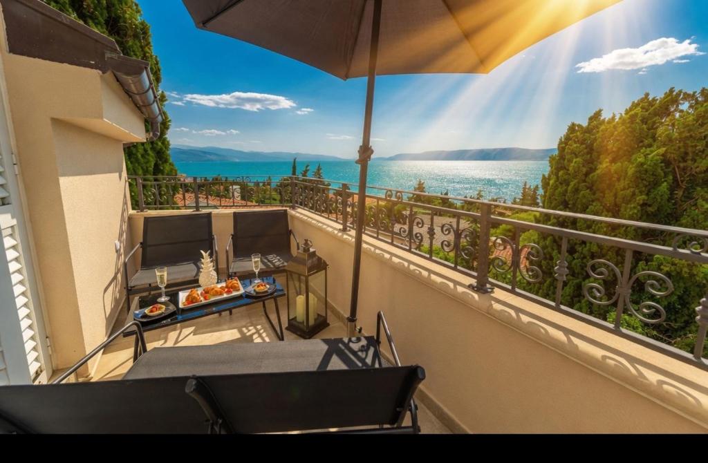 a balcony with chairs and a view of the water at Sea house Lea in Novi Vinodolski