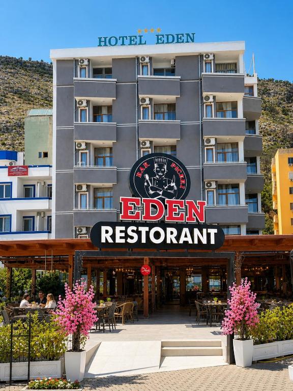a hotel with a sign that reads eden restaurant at Eden Hotel in Shëngjin