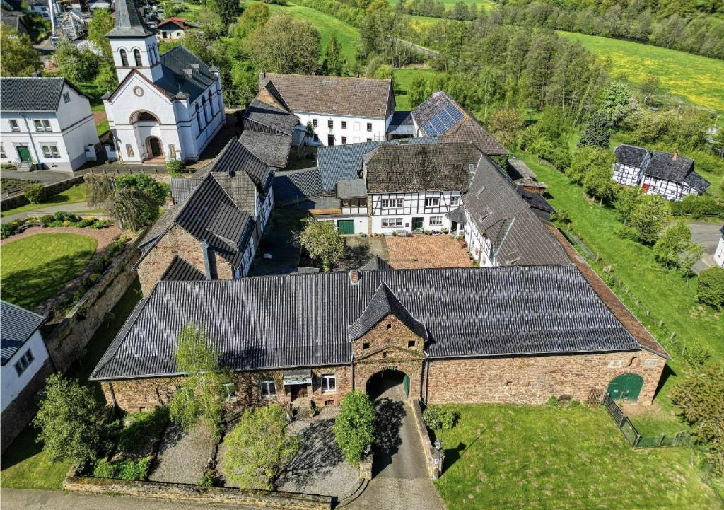an aerial view of a large estate with a church at Hostel Burg Hausen in Heimbach
