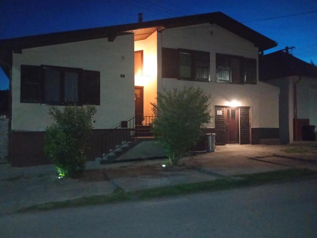 a house at night with the lights on at Pearl of Danube in Chlʼaba