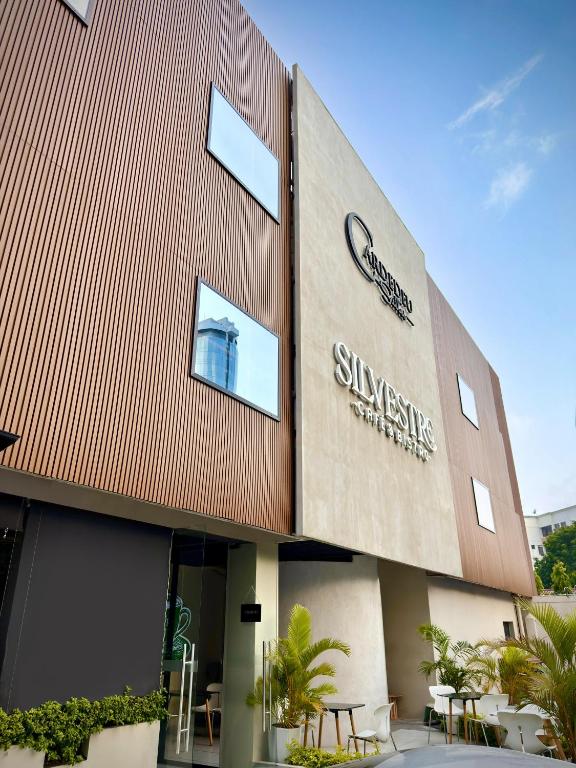 a building with a sign on the side of it at Cardedeu Suites in San Salvador