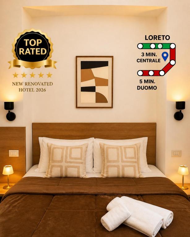 a bedroom with a bed and a sign on the wall at Hotel Aurelia Milano Centrale in Milan