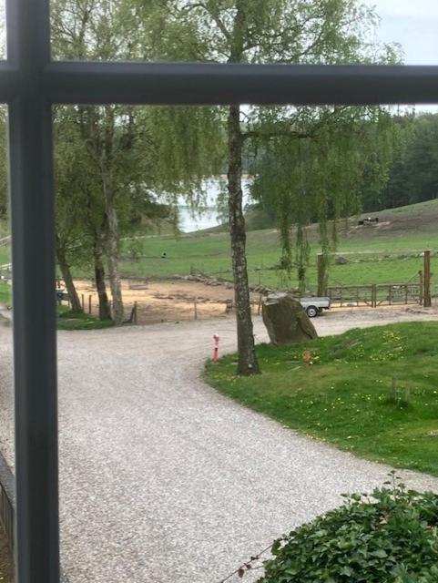 a view of a road from a window at Penthouse deluxe in Hobro