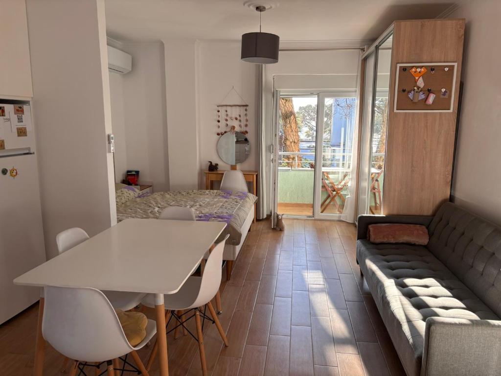 a living room with a table and a couch at Seaview Apartment Pinea Golem in Golem