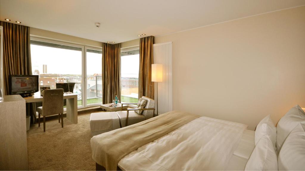 Postel nebo postele na pokoji v ubytování Thomas Hotel Spa & Lifestyle