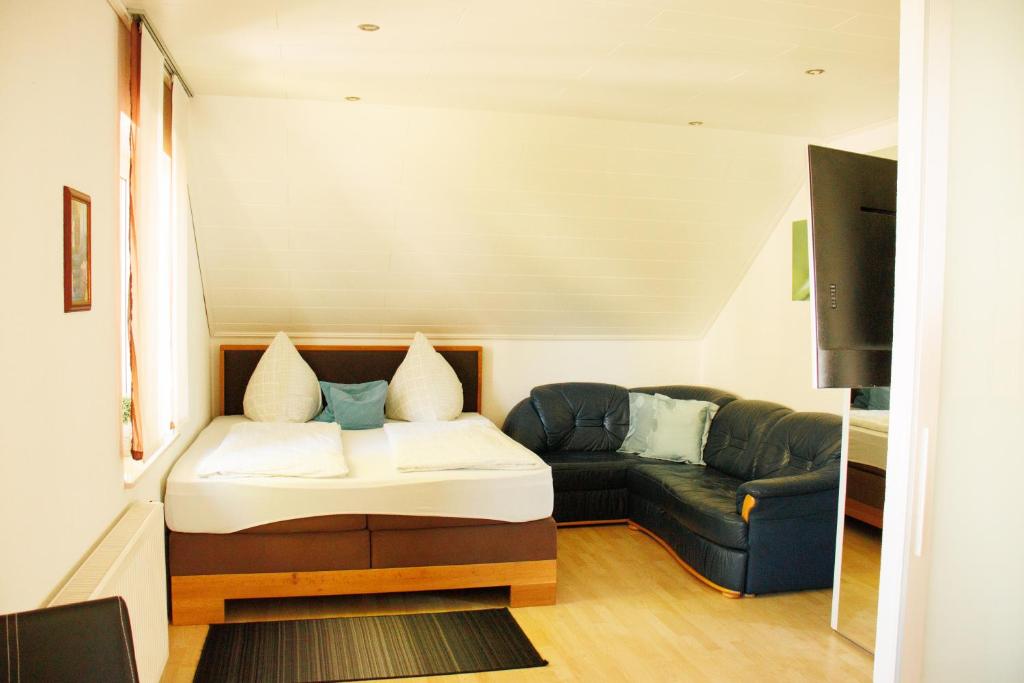 a living room with a couch and a couch and a table at Mini Wohlfühlnest in Edertal
