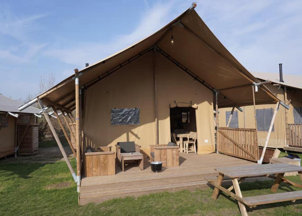 a tent with a wooden deck in a yard at F1 Weekend House Close to Spa 6 Guests Doc in Amblève
