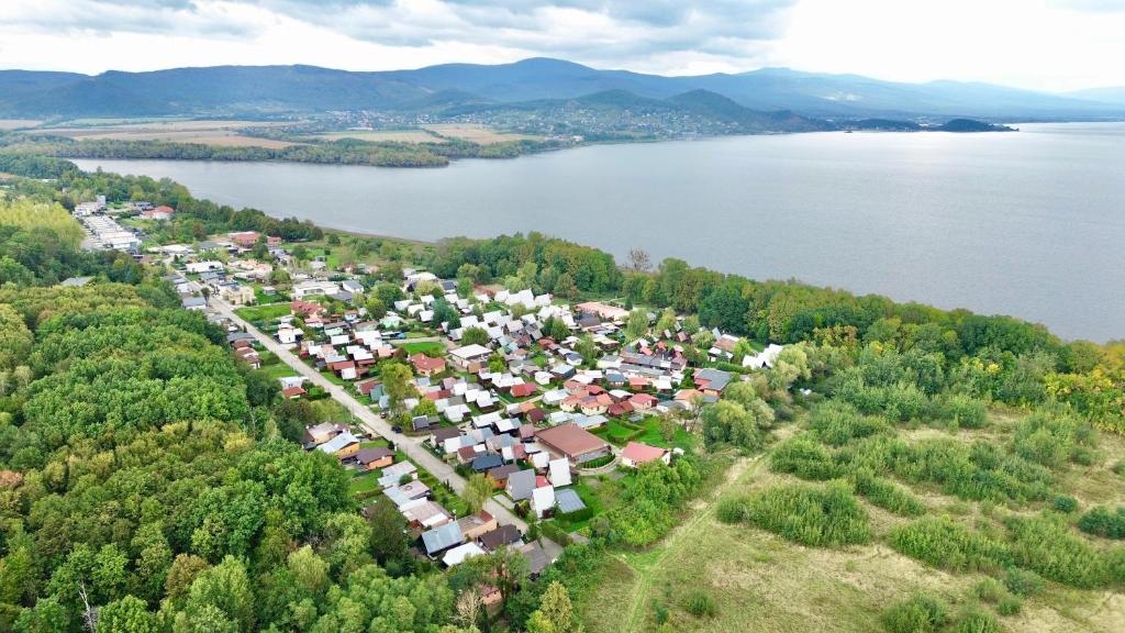 an aerial view of a small town next to a lake at Apartmány Apollo Šírava in Michalovce