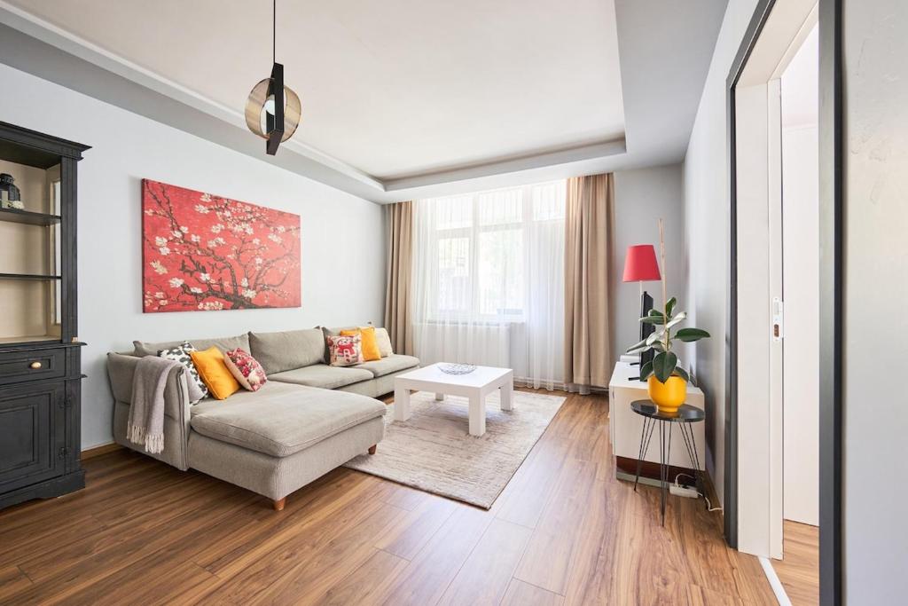 a living room with a couch and a table at Kaira Homes 1 in Ankara