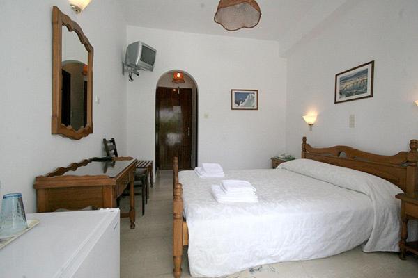 Postel nebo postele na pokoji v ubytování Atlantis Hotel