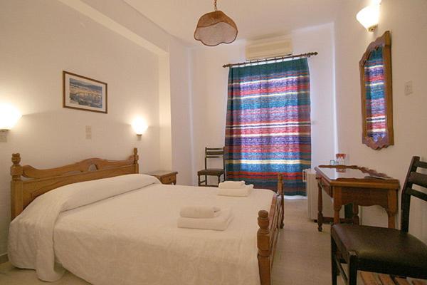 Postel nebo postele na pokoji v ubytování Atlantis Hotel