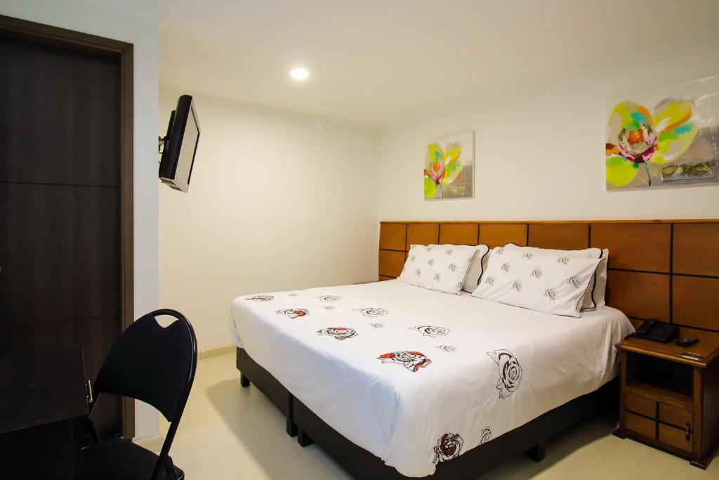 Postel nebo postele na pokoji v ubytování Hotel Casa Quinta Embajada