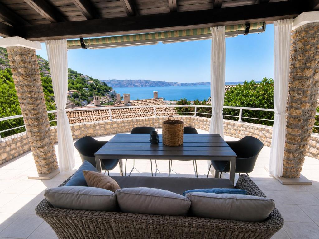 a living room with a couch and a table at Apartments Casa al Vento in Donja Klada