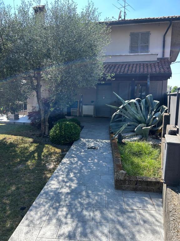 a walkway in front of a house at Franciacorta Garden House in Cazzago San Martino