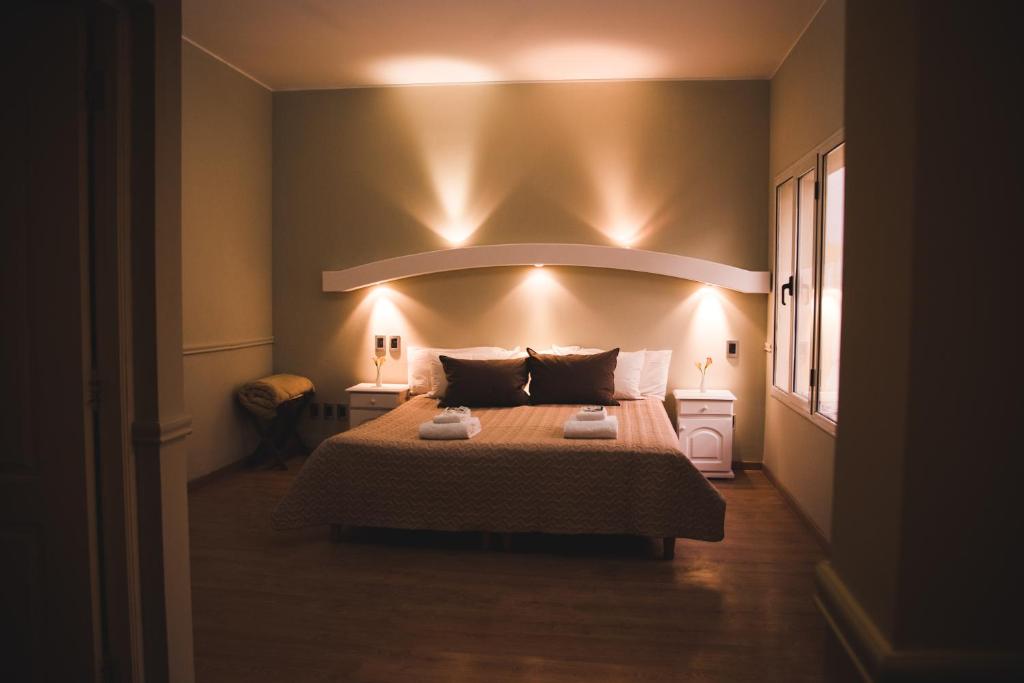 Voodi või voodid majutusasutuse San Rafael Group Hotel toas