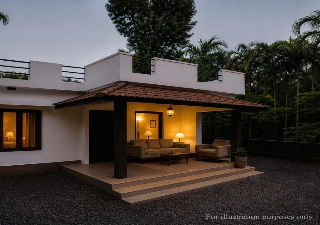 a house with a porch with two couches at Casa Horizon in Sultan Bathery